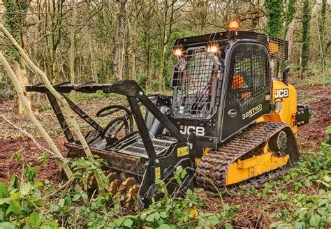 brush cutting uneven ground with a skid steer|john deere skid steer brush cutting.